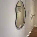 mirror being hung by Glasgow handyman service