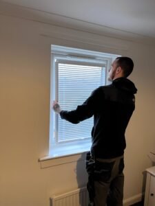 Steven’s son fitting easy-fit blinds during a Glasgow Handyman Solutions job