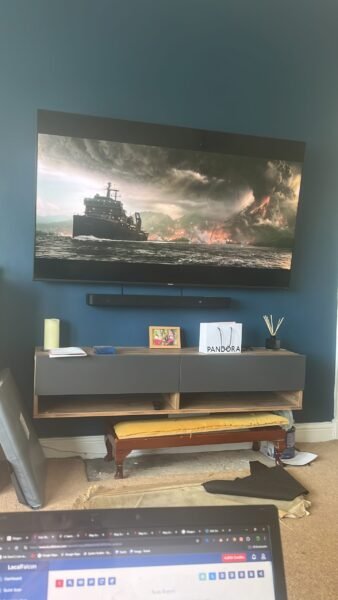 Wall-mounted flat screen TV with concealed cables in a Maryhill property