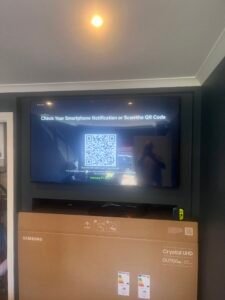 Wall-mounted 55-inch TV with hidden cables installed in a Govanhill flat
