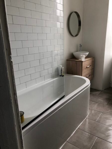 Bathroom refurbishment with new shower screen above bath