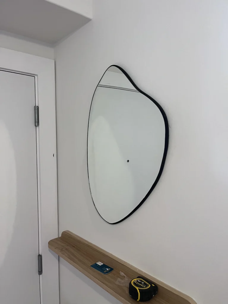 bubble mirror installed on plasterboard wall