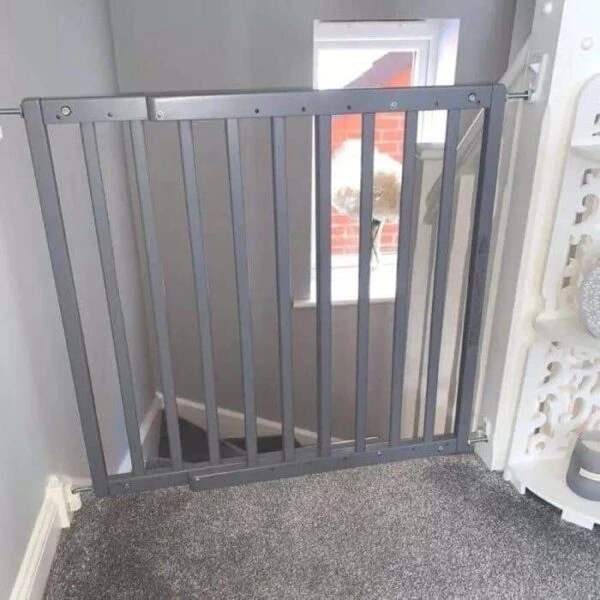 stair gate fitted at the top of hallway stairs