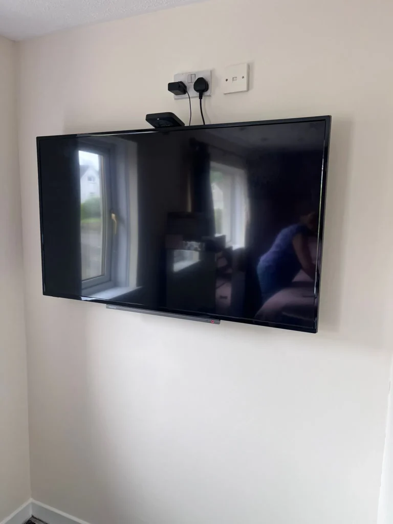 wall mounted tv with sockets