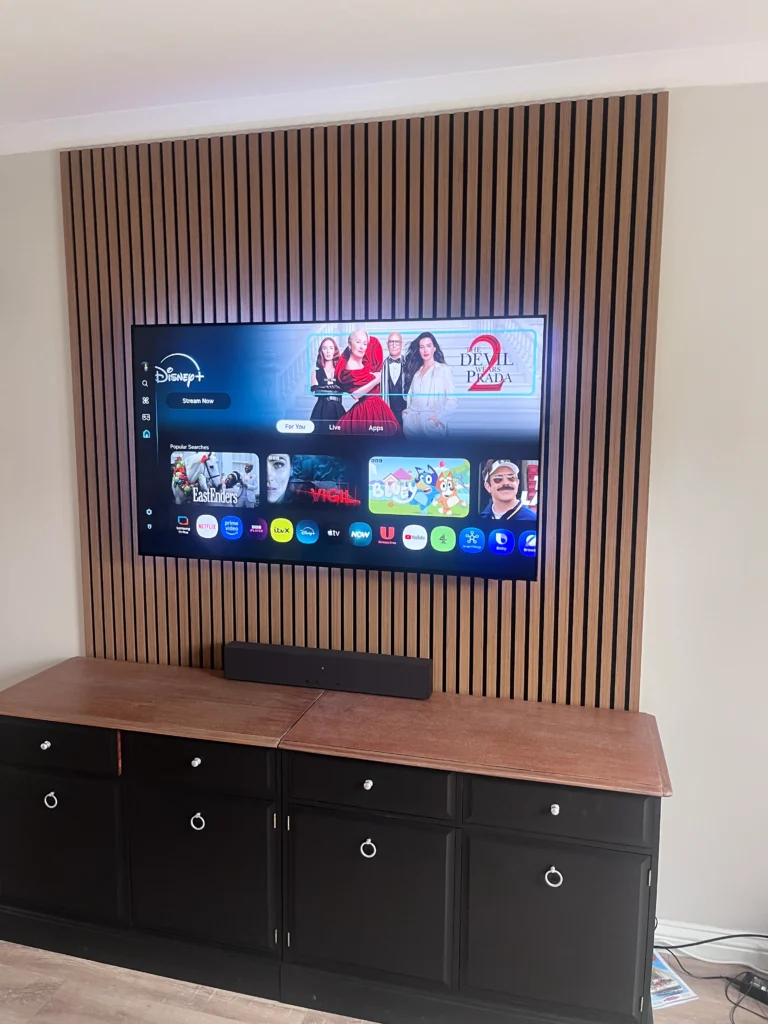 Finished Tv wall Mount over a media wall with hidden cables and sound bar Giffnock area
